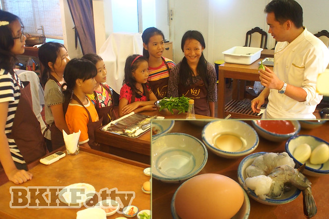 going over the ingredients in a thai cooking class in bangkok